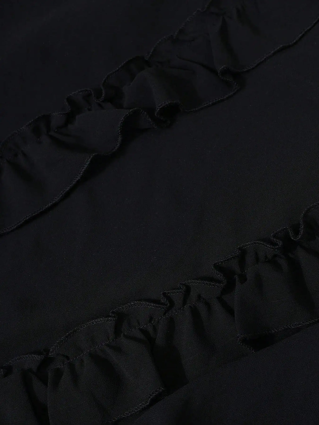 A Black Floor-length Dress and Layered Pleats