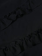 A Black Floor-length Dress and Layered Pleats