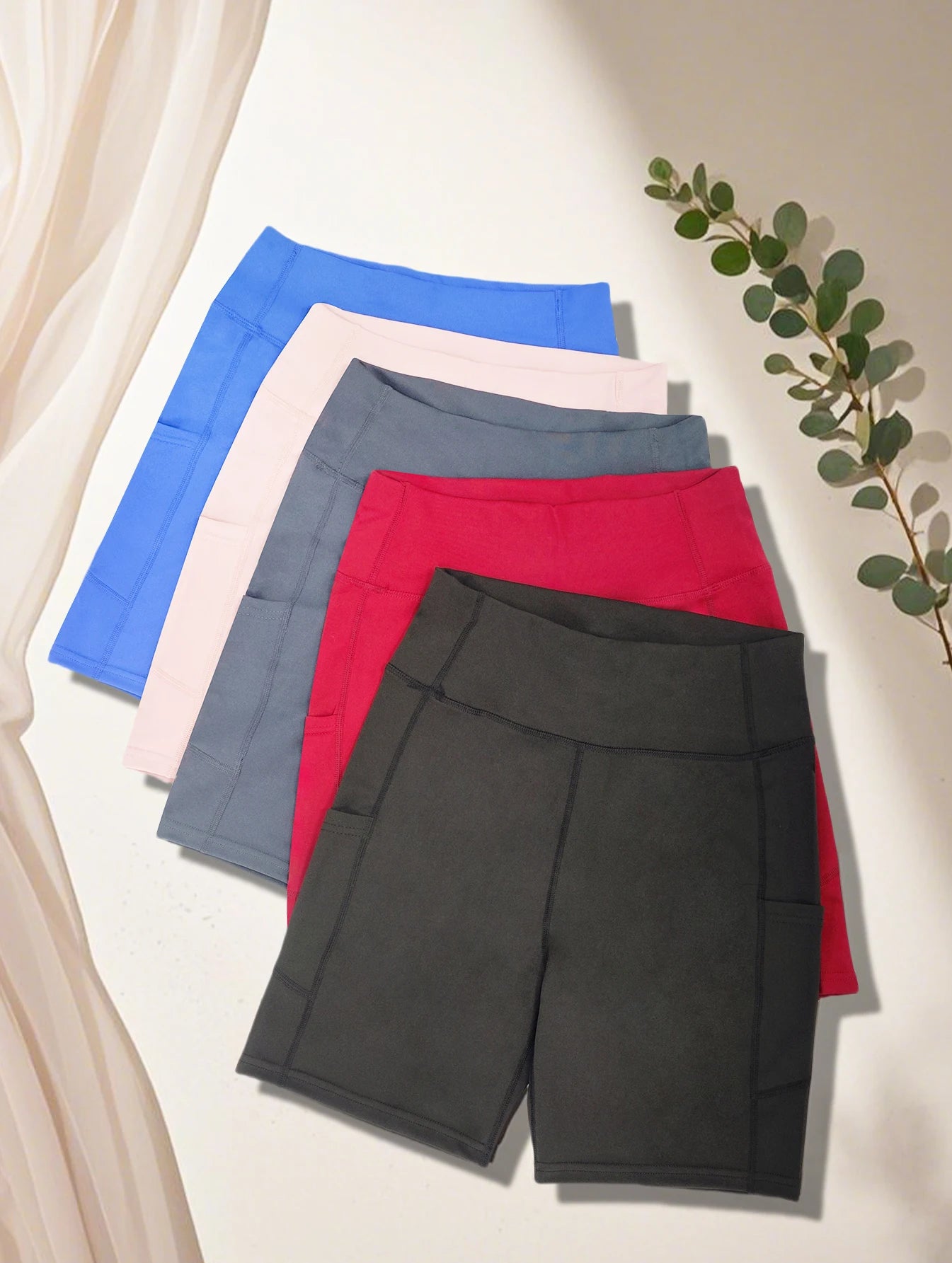 High-tummy-control shorts; pocket style.