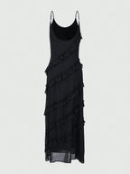 A Black Floor-length Dress and Layered Pleats
